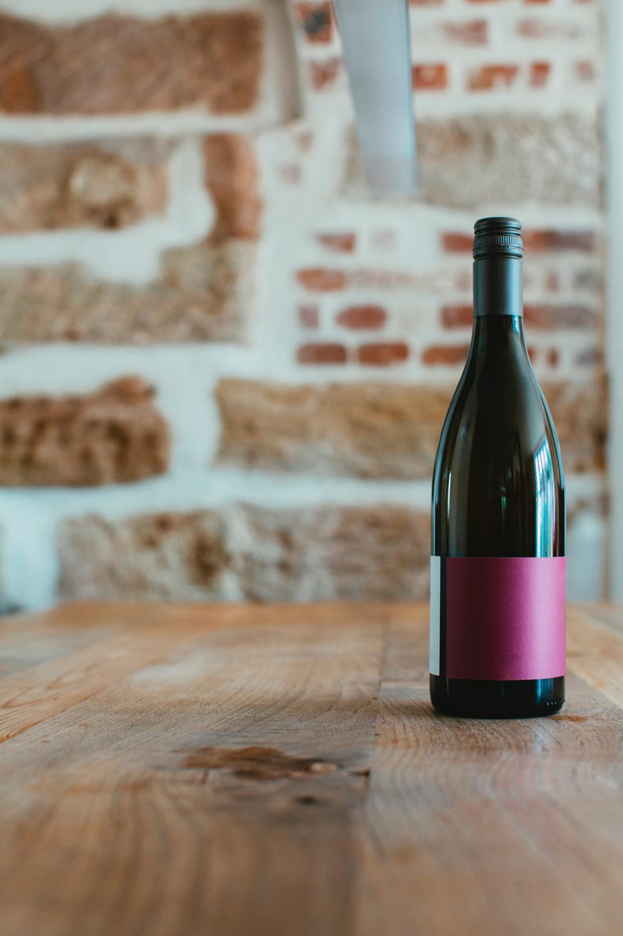 Wine bottle, brick background